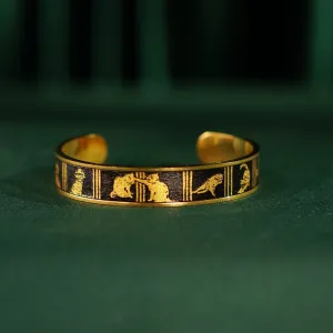 The "Cat & Box" Metal Cuff Bracelet With Hand-Painted Leather is a handmade fashion accessory that beautifully highlights individuality, making it a perfect birthday gift for her.