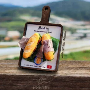 The Vietnamese Food Tray Fridge Magnet from the Little Vietnam Collection is a charming decorative souvenir, perfect as a Vietnamese specialty refrigerator magnet and a unique keepsake