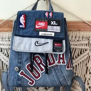 Mini Jordans backpack showcasing personality through every patchwork detail, handcrafted from upcycled old jeans as a unique fashion statement and memorable birthday gift.