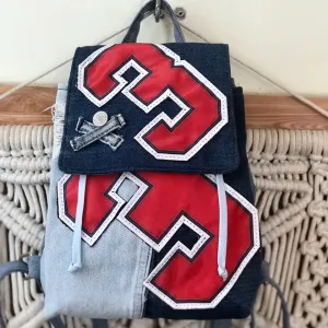 Mini number 3 backpack from old jeans is the perfect way to express personal style, a unique sustainable fashion accessory and creative birthday gift.
