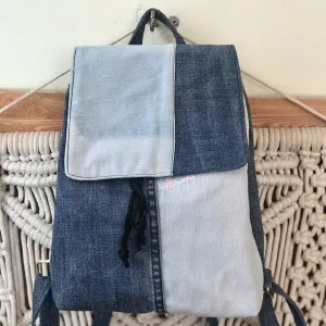 Blue mix backpack from old jeans conquering minimalist enthusiasts, an upcycled fashion accessory and unique birthday gift for sustainable style lovers.