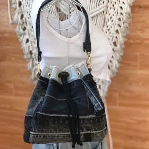 Gray and black bucket bag from old jeans features signature mark on every line, creating a jeans handbag as sustainable fashion accessory for impressive birthday gift and handcrafted gift