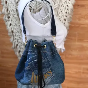 7LUCKY bucket bag from old jeans serves as companion for dynamic days, featuring drawstring design as upcycled jeans accessory and creative handcrafted birthday gift.