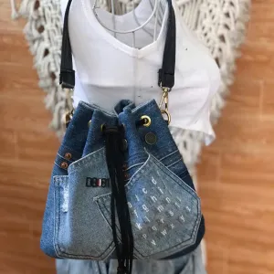 Blue printed letter bucket bag from old jeans with passion infused in every detail, creating an upcycled convenient drawstring bag and impressive birthday gift