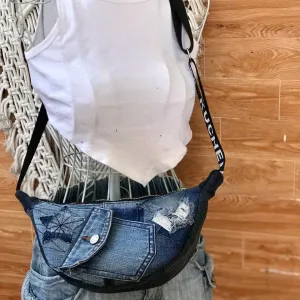 Half-moon crossbody bag with flap from old jeans balancing convenience and uniqueness, creating an upcycled denim crossbody bag and creative birthday gift for eco-fashion lovers