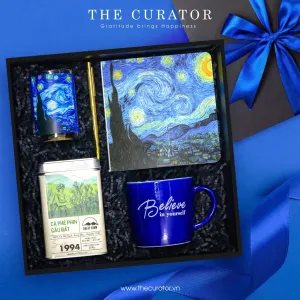 "Believe In Spirit gift box impresses through Van Gogh's timeless artistry, featuring an elegant ceramic mug paired with a refined notebook alongside aromatic scented candle and premium coffee, creating a thoughtful birthday present or sophisticated corporate gift that inspires creativity.