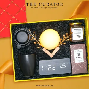 Urban Spirit gift box delivers complete premium experience featuring elegant watch and sophisticated night lamp paired with fine coffee and chocolate, creating exceptional corporate gift and luxury birthday present