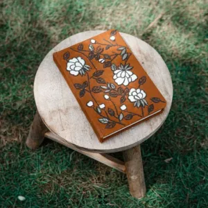 Hand-embroidered nature motif notebook, blending art and functionality, a unique Vietnamese souvenir and handmade gift with diverse designs.