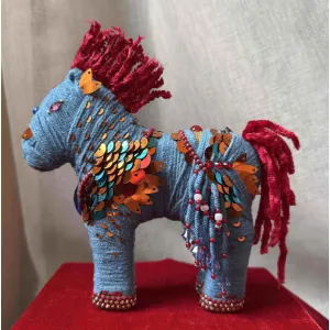 "Deep Sea Version Cloud Horse, measuring 16.5 x 14.5cm, embodies a strong and persistent character through its handcrafted wool construction, serving as a unique decorative item and meaningful feng shui gift that makes a thoughtful handmade present