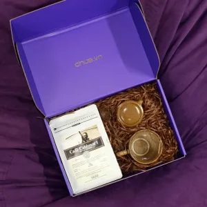 Exclusive "Coffee" Gift Set, where ceramic art meets the finest coffee, featuring a coffee selection, ceramic cup, and wooden spoon, all packaged in a premium gift box perfect for any occasion.