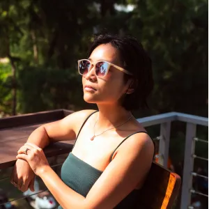 Brown frame sunglasses made from recycled plastic featuring an impressive elegant design, providing effective UV protection with premium quality, serving as both an eco-friendly recycled accessory and unique thoughtful birthday gift.