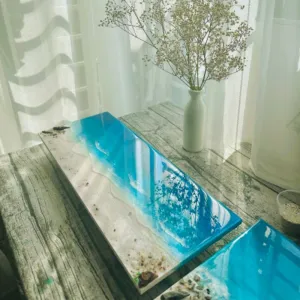 3D epoxy resin beach painting captures vibrant ocean beauty through lifelike dimensional effects, showcasing exquisite handcraftsmanship as distinctive home decor, impressive artistic gift and unique housewarming present.