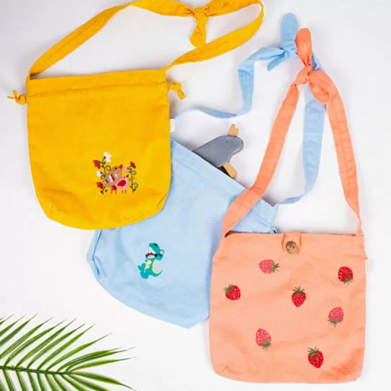 kids bag, cute small design, vibrant colors, adorable patterns, with drawstrings or buttons, suitable for both boys and girls