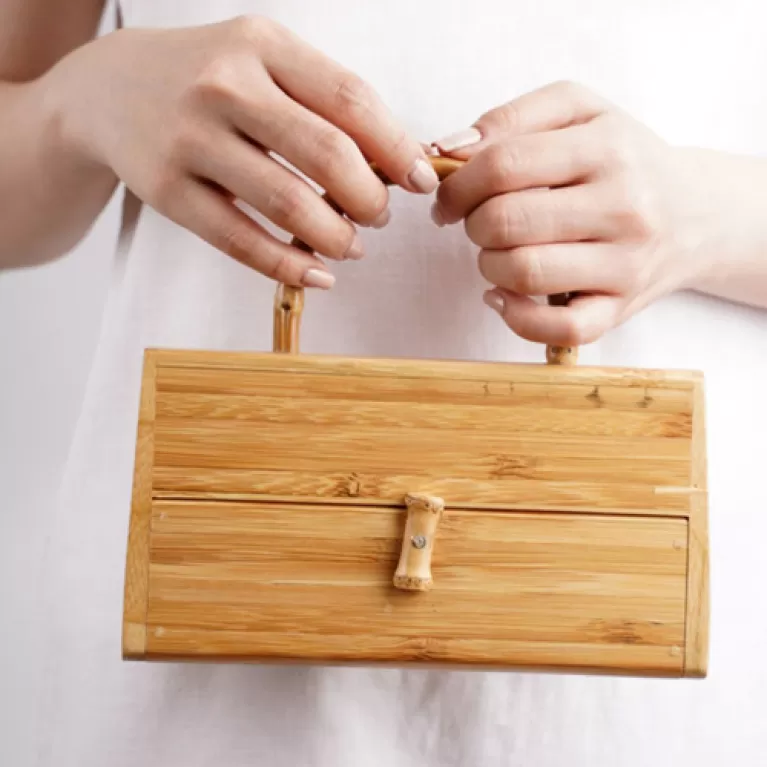 box shaped bamboo handbag, inspired by treasure chests, 100% bamboo material, unique and eye-catching accessory