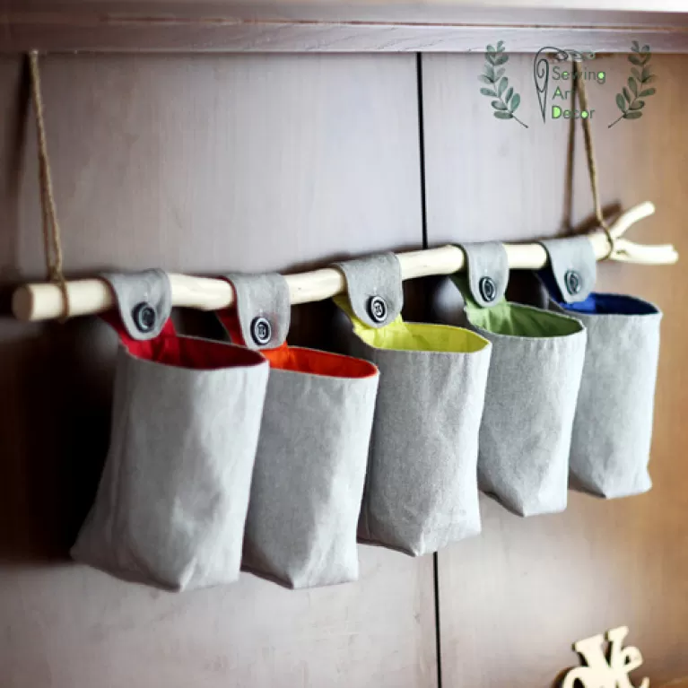 cloth hang wall organizer, neatly stores items, unique design, made from cotton canvas, sturdy and durable, home decor
