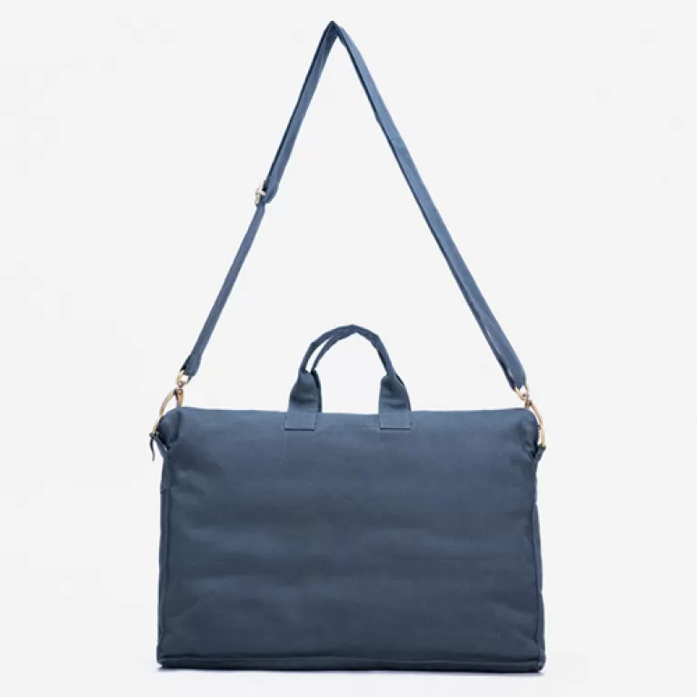 canvas working bag, multiple separate compartments, fits a laptop, can be worn crossbody or carried by hand