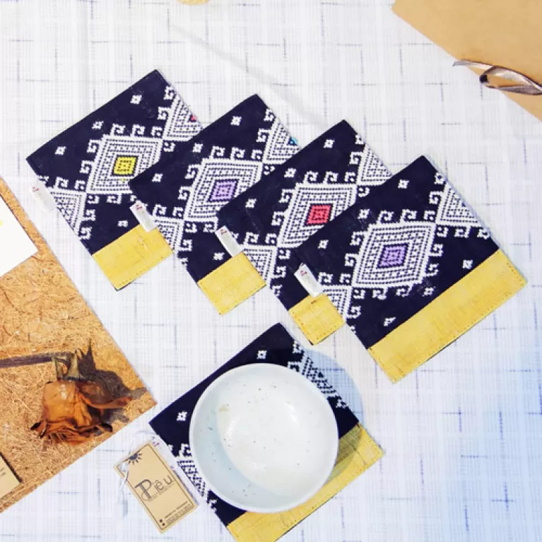 brocade coaster, rustic patterns, absorbent fabric material, naturally dyed colors, simple design, handcrafted product