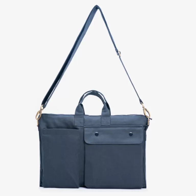canvas working bag, multiple separate compartments, fits a laptop, can be worn crossbody or carried by hand