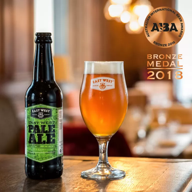 east west pale ale bottle, craft beer, bottle 330ml, handcrafted craft beer, premium brewing, distinctive aroma, pure deliciousness