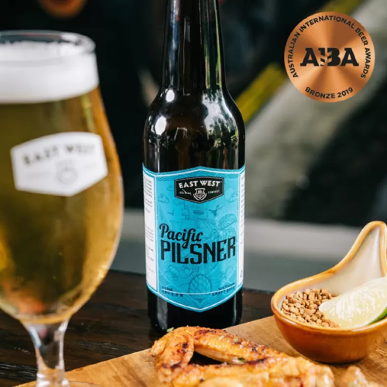 pacific pilsner beer bottle, craft beer, unique craft beer flavor, mild malt aroma and sweet-sour lime, refreshing taste