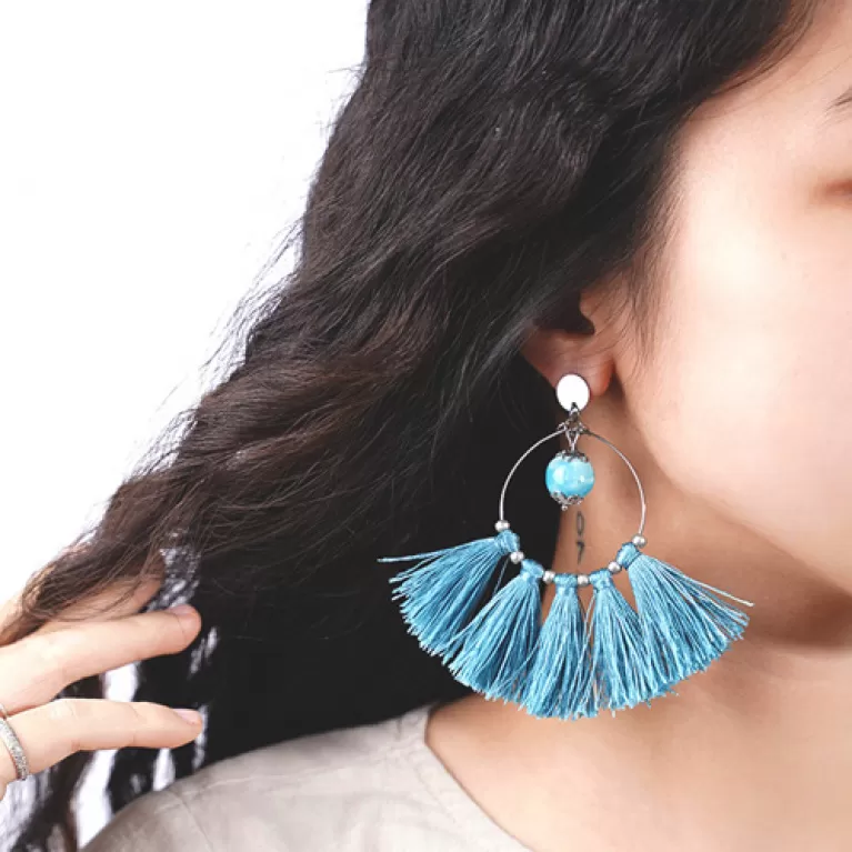 round tassel earrings, large round design, cool turquoise color, handmade fashion accessory, captivating