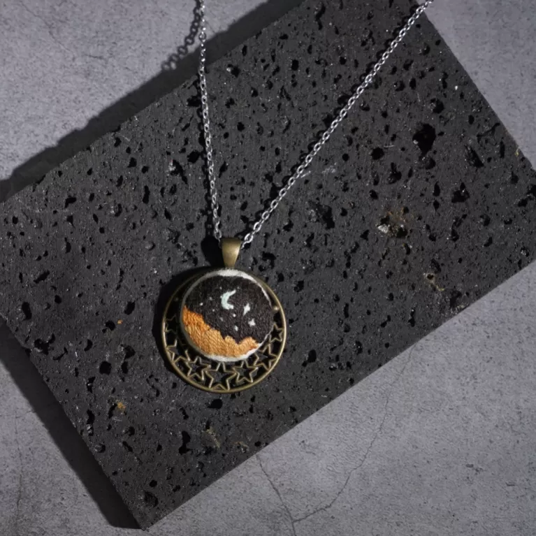 night sky pendant necklace with hand-embroidery, dreamy and romantic design, classic copper frame, unique accessory