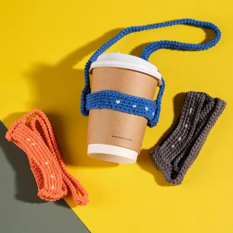 crochet cup holder, convenient for carrying water bottles, replaces nylon handles, stylish accessory, essential item for eco-friendly living