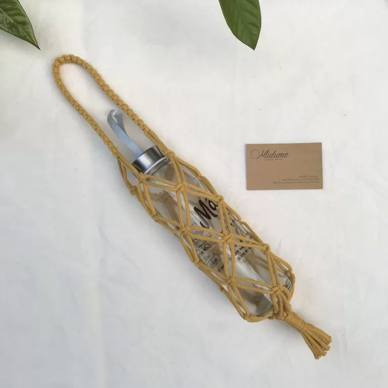 macrame bottle holder, eye-catching and unique design, intricately knotted macrame button, durable material, reusable