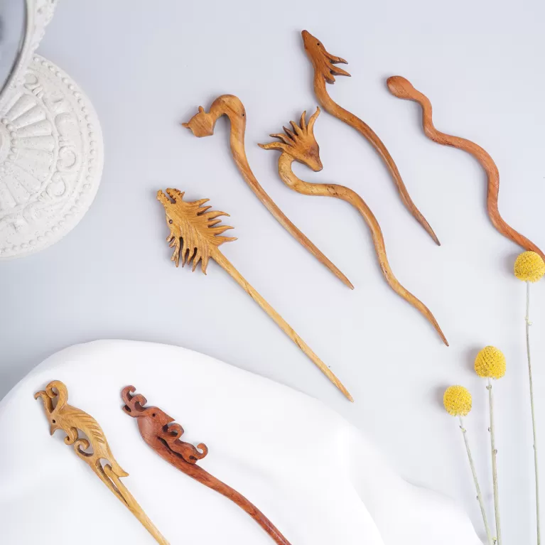 animal-shaped wooden hair pins, diverse designs, natural wood colors and grain, unique hair accessories, made from natural materials