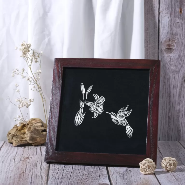 silver rufous-crested hummingbird sucking nectar, silver home decor, vivid lines, intricate technique, handcrafted product, premium gift