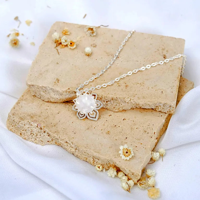 "an" silver necklace with moonstone pendant, delicate chain, elegant design, gentle beauty, suitable for various outfits