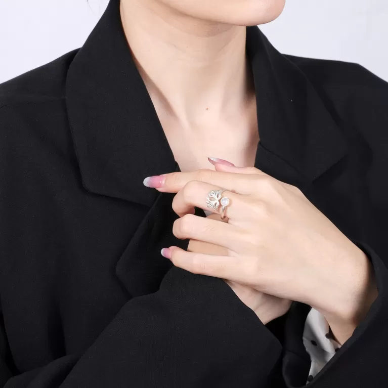 “an” moonstone silver ring, delicate appearance, contemporary design, enhancing the beauty of the hand, natural moonstone