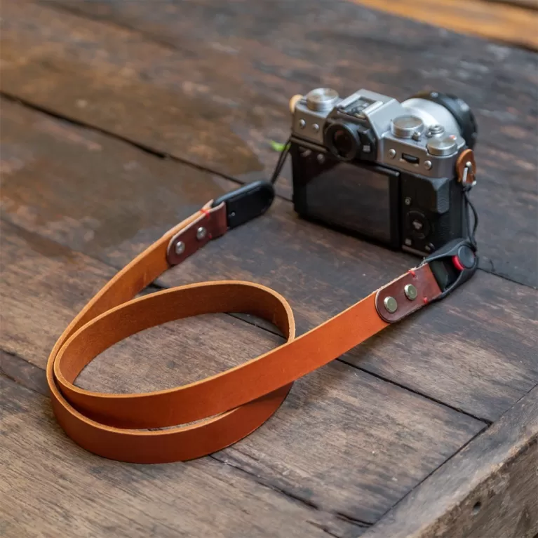 vachetta leather camera strap, flexible and durable material, rustic style, simple strap design, retro style
