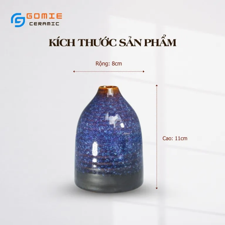The Ocean Blue Fire-Glazed Ceramic Narrow Mouth Vase, sized 8 x 11cm, adds a distinctive touch to your space as a stunning Bat Trang flower vase, perfect for home decor or as a thoughtful housewarming gift.