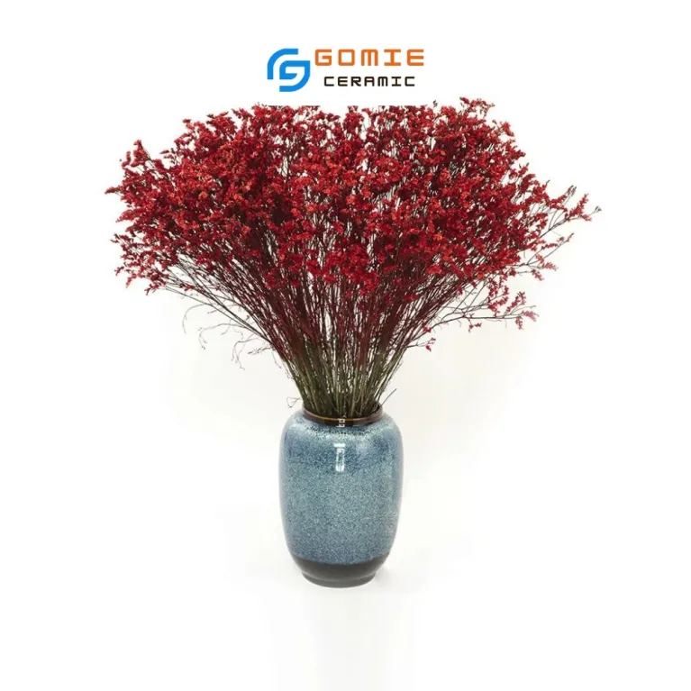 The Ocean Blue Fire-Glazed Ceramic Tube Vase from Bat Trang Ceramics is a minimalistic yet memorable cylinder pottery vase, perfect for home decoration or as a thoughtful housewarming gift.