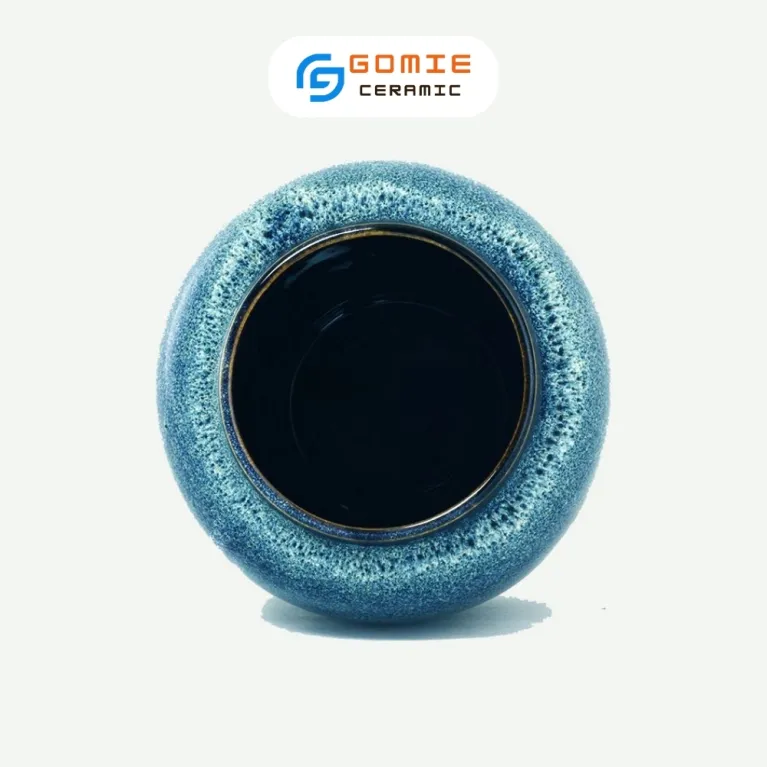 The Ocean Blue Fire-Glazed Ceramic Tube Vase from Bat Trang Ceramics is a minimalistic yet memorable cylinder pottery vase, perfect for home decoration or as a thoughtful housewarming gift.