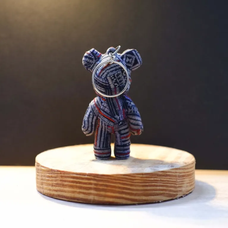 The Brocade Bear Keychain, made from recycled H'Mong fabrics, combines a unique ethnic vibe with mini Bearbrick style—perfect as a Vietnamese gift.