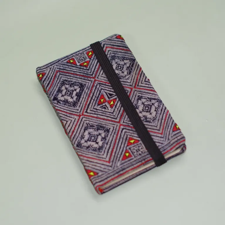 The Brocade Notebook, crafted with a cover of brocade fabric recycled from traditional H'Mong costumes, makes a meaningful gift for foreigners