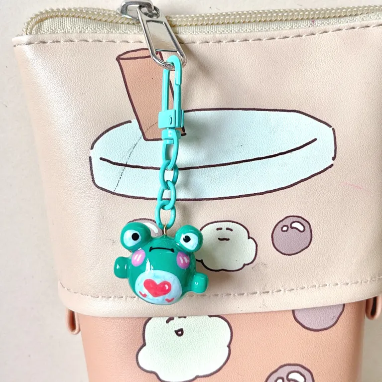The Handmade Clay Colorful Frog Keychain boasts an adorable and charming look, making it the perfect clay bag charm, unique accessory, and lovely handmade gift, a thoughtful gift for her!The Handmade Clay Colorful Frog Keychain boasts an adorable and charming look, making it the perfect clay bag charm, unique accessory, and lovely handmade gift, a thoughtful gift for her!