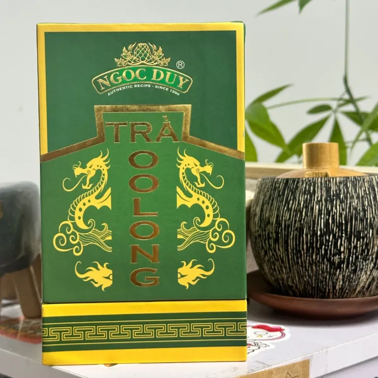 Experience the essence of Da Lat Premium Oolong Tea in a 100g box, crafted with natural ingredients to capture the purity of tea buds, making it a good-for-health Vietnamese tea and the perfect health gift for family.Experience the essence of Da Lat Premium Oolong Tea in a 100g box, crafted with natural ingredients to capture the purity of tea buds, making it a good-for-health Vietnamese tea and the perfect health gift for family.