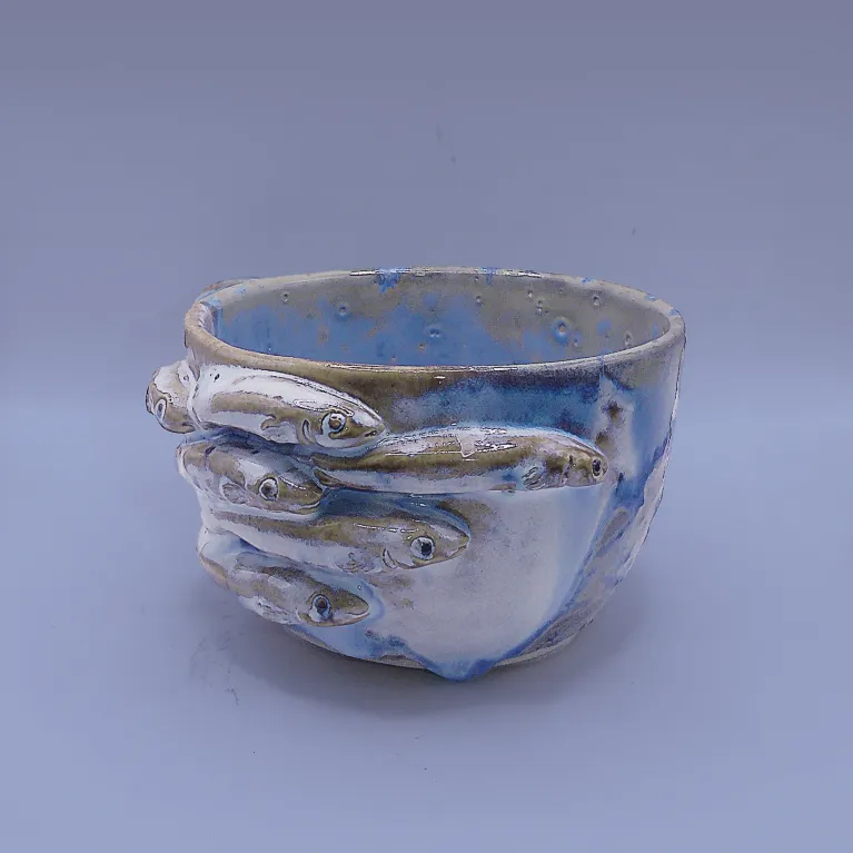 The "Fish-FLick" Ceramic Mug is a handmade abstract ceramic piece that serves as a daily reminder to stay calm, making it a unique addition to your home decor and a perfect unique handmade gift