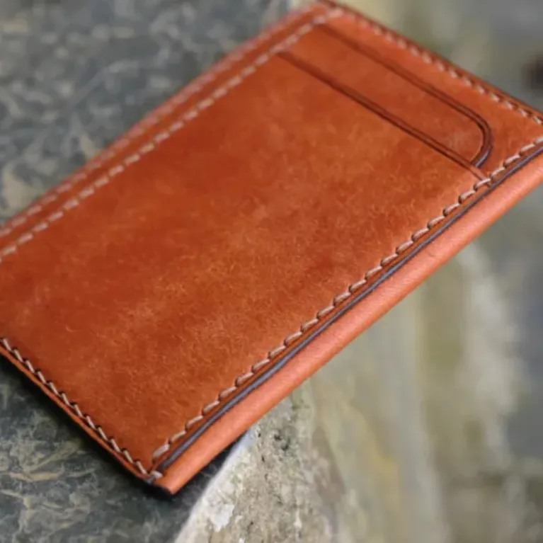 The Personalized Leather Card Holder is a luxury men's wallet with 4 compartments, crafted by hand as a perfect gift for him and a standout piece of artisan accessories.