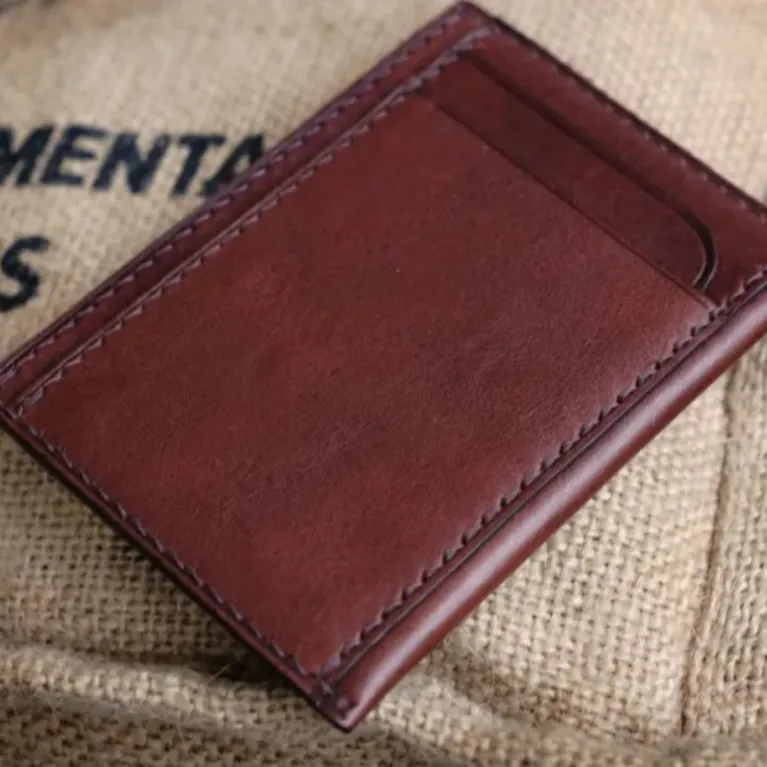 The Personalized Leather Card Holder is a luxury men's wallet with 4 compartments, crafted by hand as a perfect gift for him and a standout piece of artisan accessories.