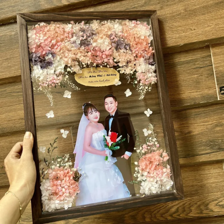 Personalized Dried Flower Photo Frames offer a unique way to cherish memories, allowing you to customize the photo, colors, and quotes in a beautifully crafted dried flower frame, making it the perfect personalized gift