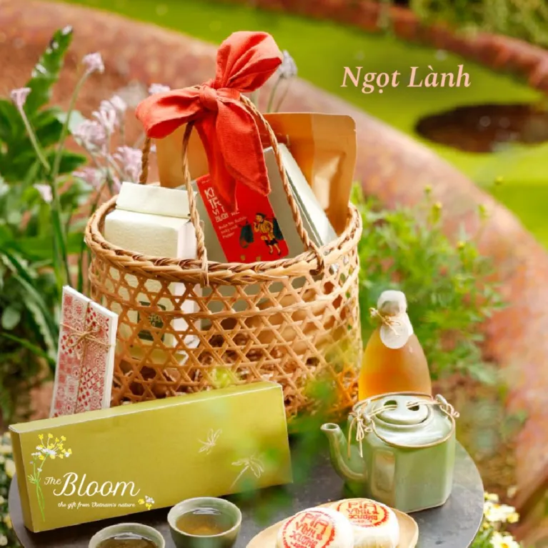 Celebrate a peaceful spring with the "Sweet and Wholesome" Tet Gift Basket, a luxurious corporate gift featuring Vietnamese specialty treats, beautifully presented in a traditional handwoven basket.