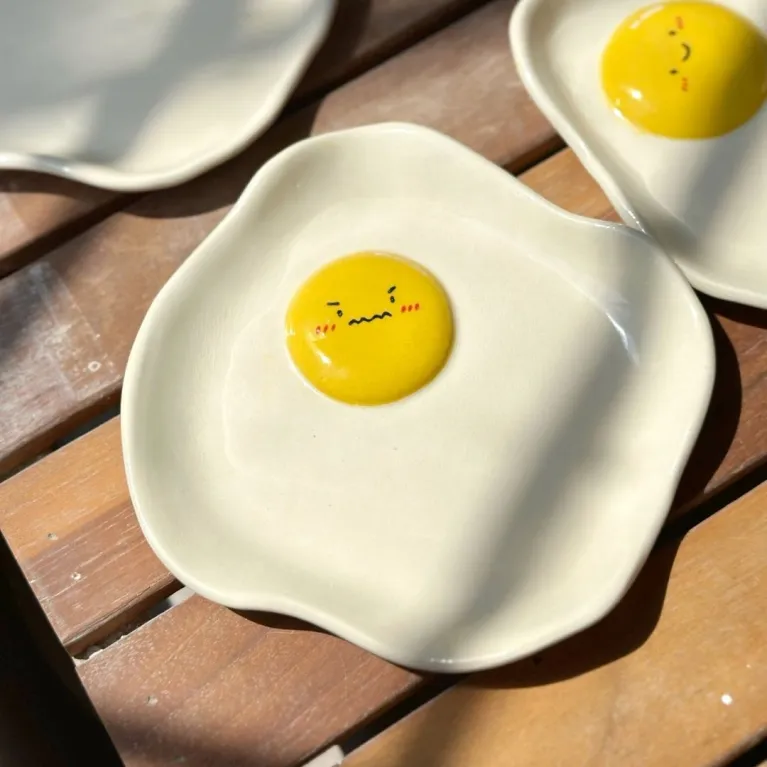 The Ceramic Egg Plate is a unique joy for every meal, featuring a handmade porcelain design that adds charm to your kitchen, making it the perfect gift for kids or a thoughtful birthday gift