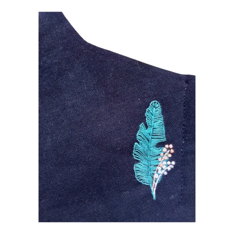 The Feather Embroidery Linen Face Mask offers elegance in every moment, featuring a handmade 3-ply design with adjustable straps, combining eco-friendly materials and intricate craftsmanship for a stylish and sustainable accessory