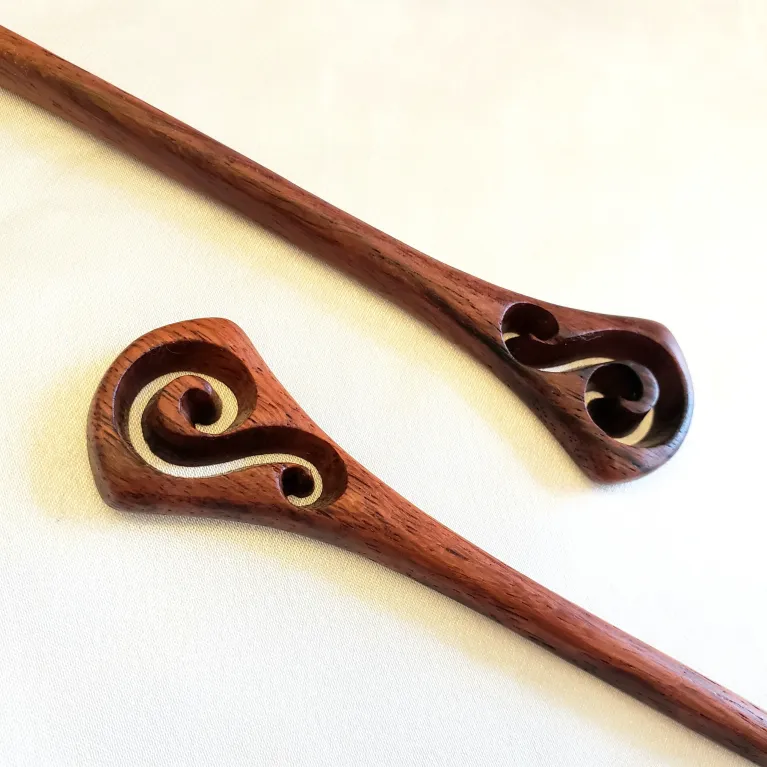 The Traditional Wooden S-Pattern Hair Stick radiates with elegant beauty, offering a classic touch to any hairstyle - an exquisite traditional hair accessory that makes a perfect birthday gift for her