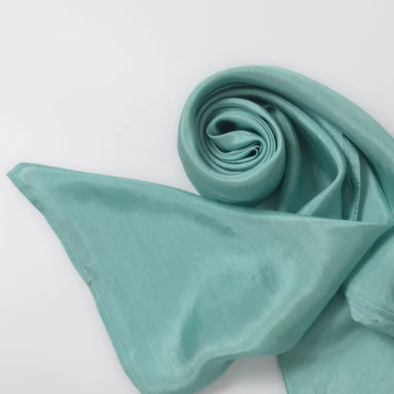 The Seafoam Silk Scarf, crafted from natural silk in Vietnam, offers a lively and refreshing touch, making it a multifunctional handmade accessory that serves as the perfect Vietnamese gift for her