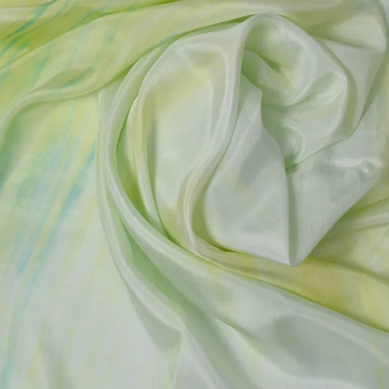 The "Wood" Silk Scarf, part of the Five Elements Collection, is an 85x190cm natural green ombre silk accessory, perfect as a Feng Shui-inspired Vietnamese gift or souvenir.